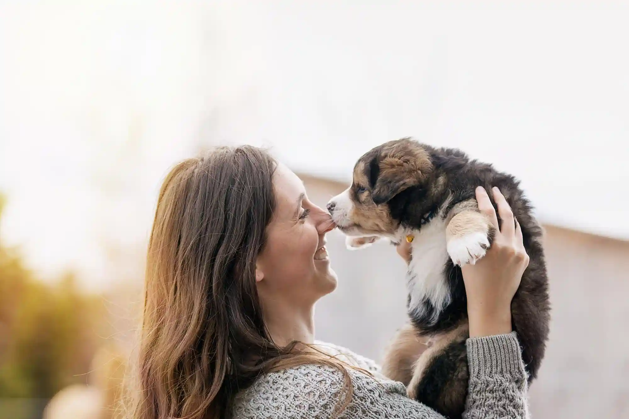 A woman with a puppy